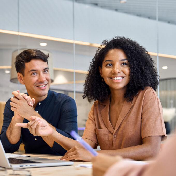 Happy diverse people executive team working together at group office meeting.